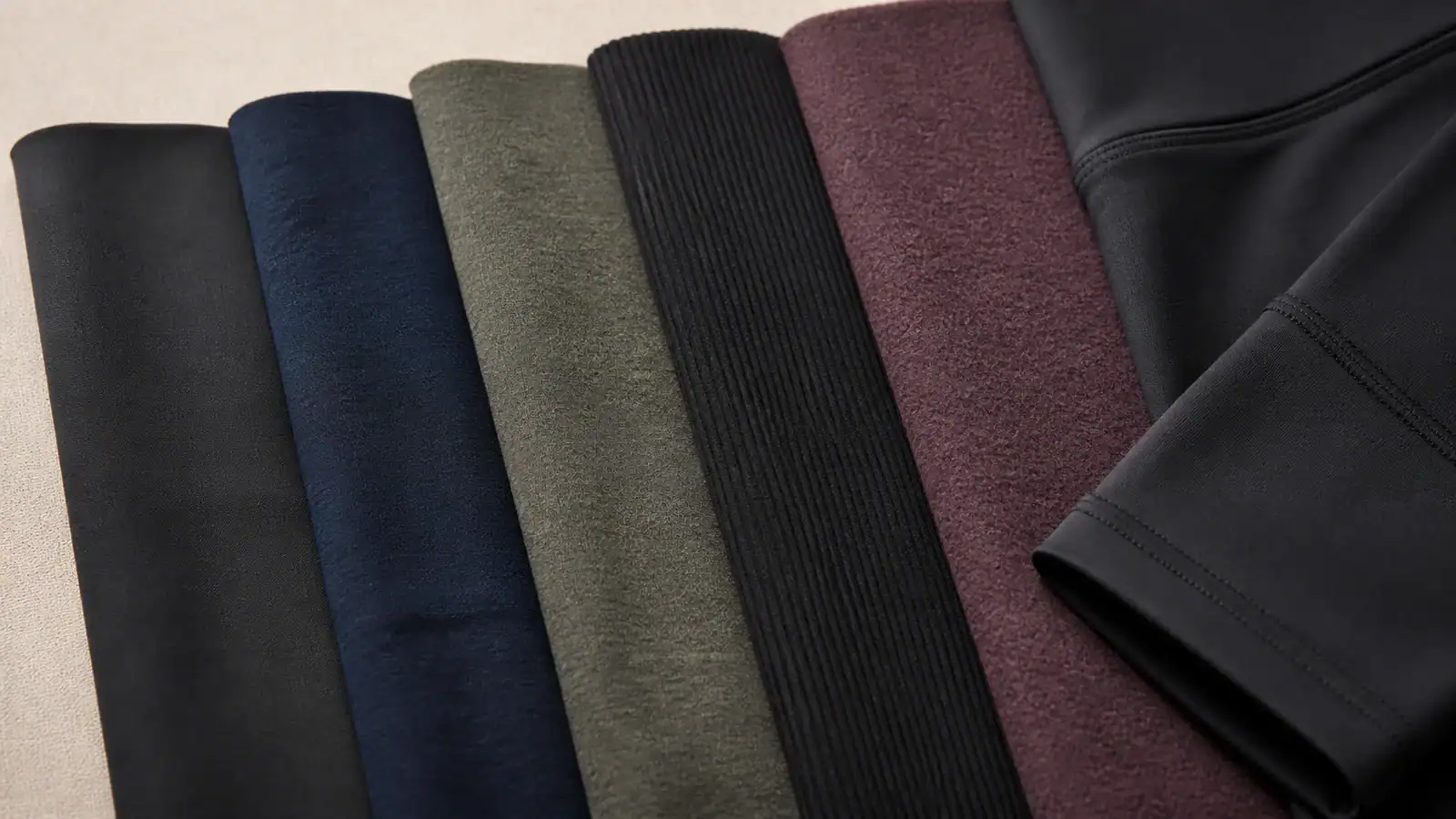 Variety of fabric swatches for custom activewear clothing.