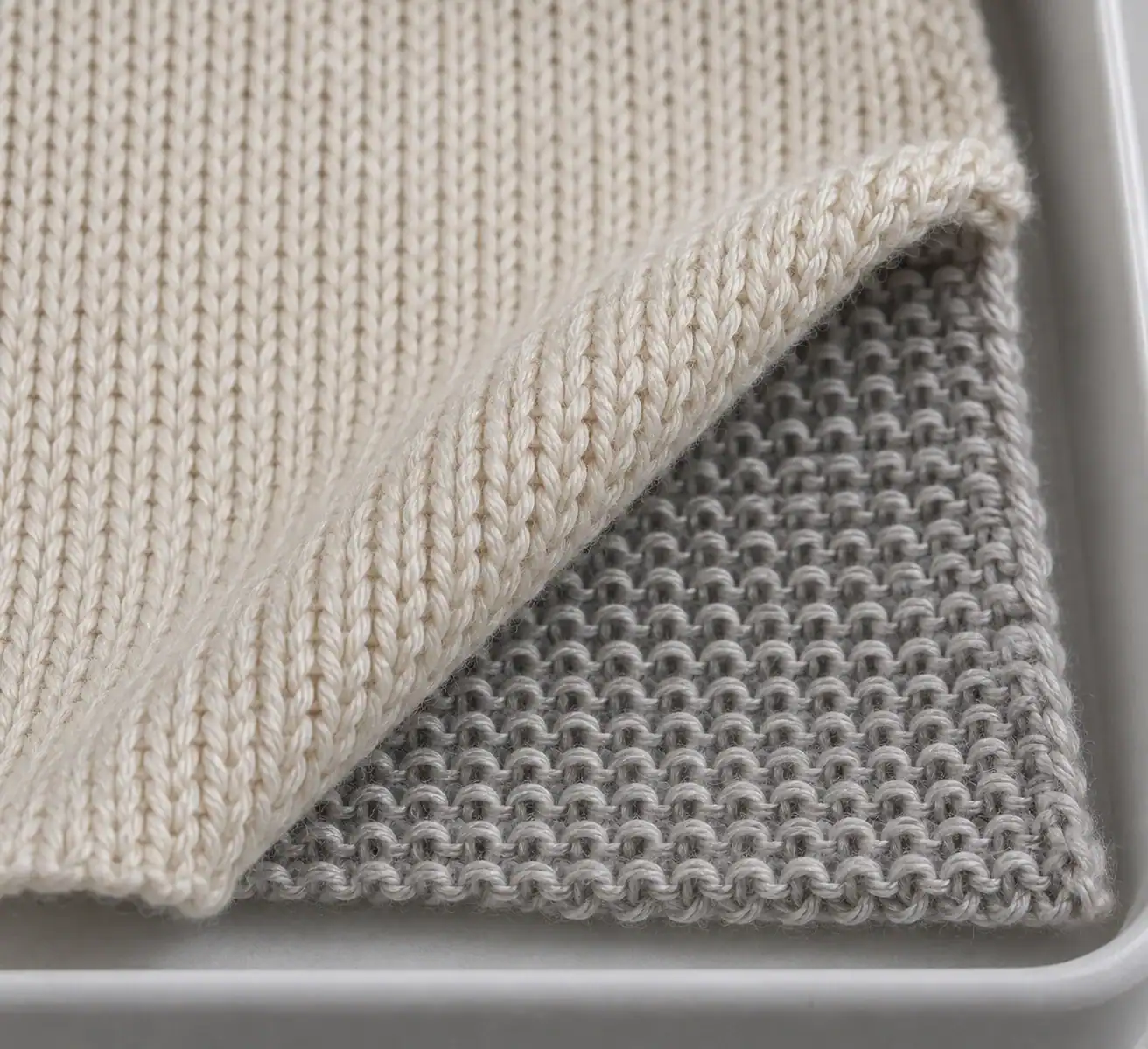 Macro view of jersey knit loops showing the different face and reverse surfaces