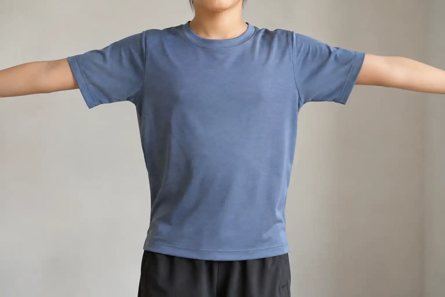 A youth sports T-shirt checked for comfortable shoulder movement